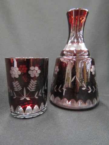 Appraisal: Ruby Cut-to-Clear Bedside Decanter with tumbler as cover etched floral