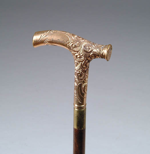 Appraisal: CARVED IVORY HANDLED CANE The L-shaped handle has carved leaves