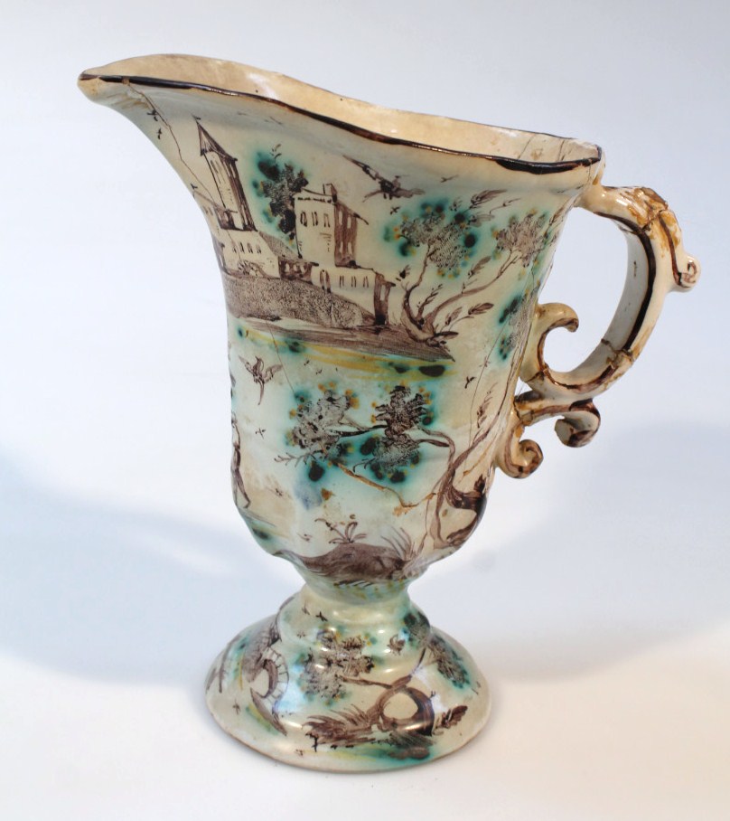 Appraisal: An thC faience ewer the shaped body polychrome decorated with