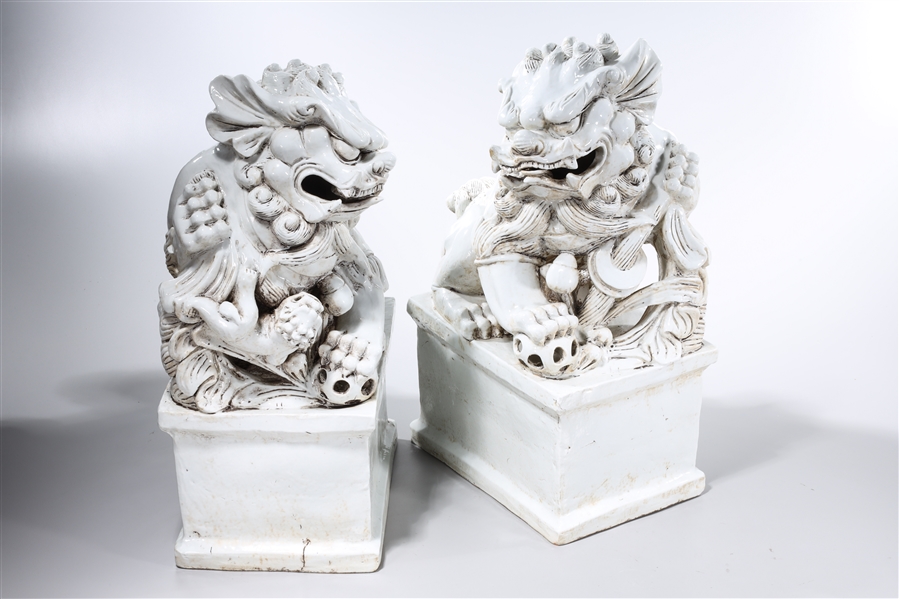 Appraisal: Pair of Chinese white glazed porcelain fo lions x x