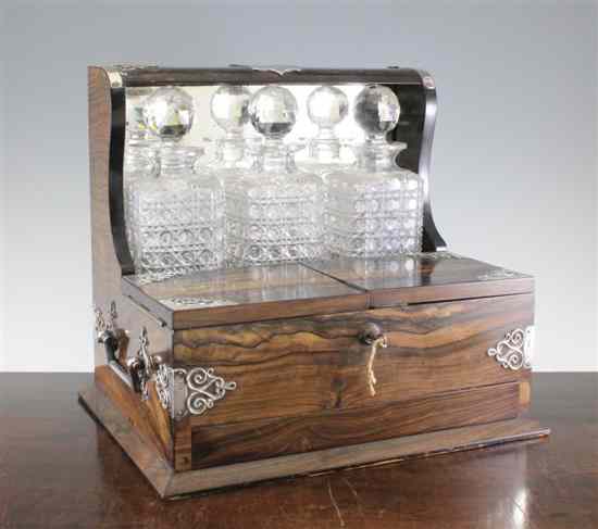 Appraisal: A late Victorian silver mounted coromandel wood tantalus with three