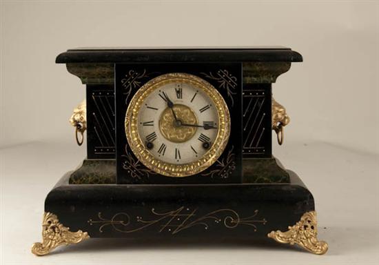 Appraisal: E N Welch Clock with Lions wooden case day time