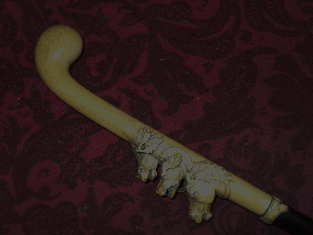 Appraisal: A good quality ebony walking cane with well detailed carved