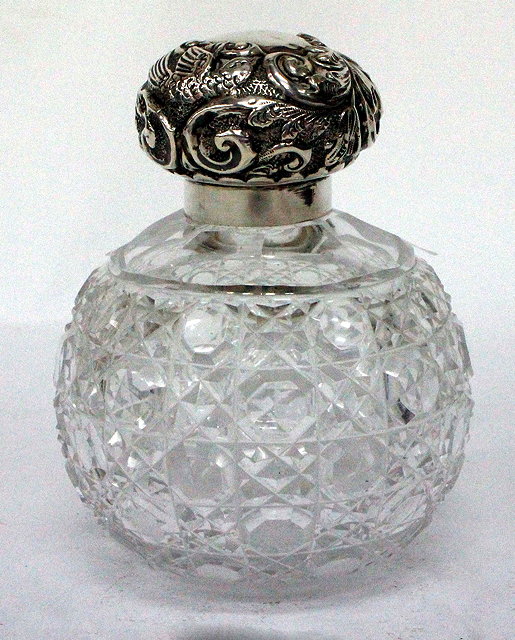 Appraisal: A CHESTER SILVER TOPPED CUT GLASS SCENT BOTTLE the top