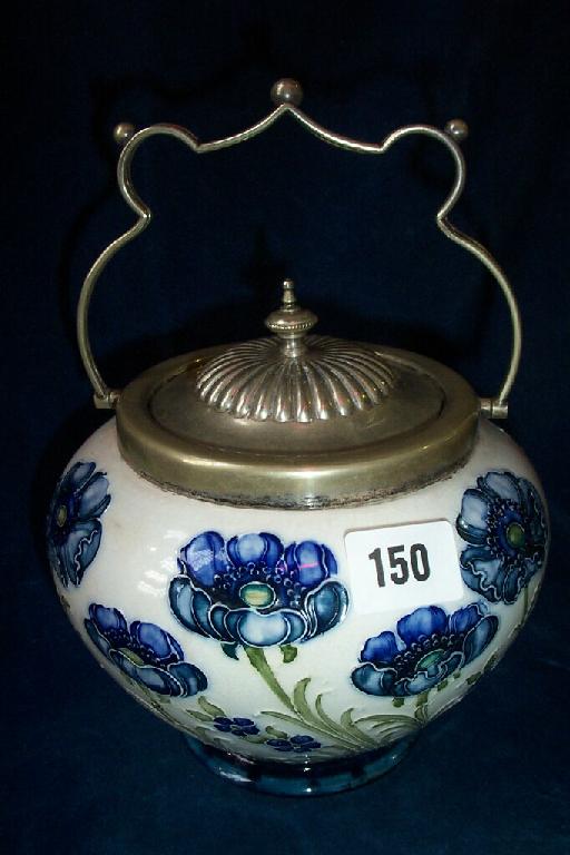 Appraisal: A Moorcroft Macintyre cream ground biscuit barrel with painted and