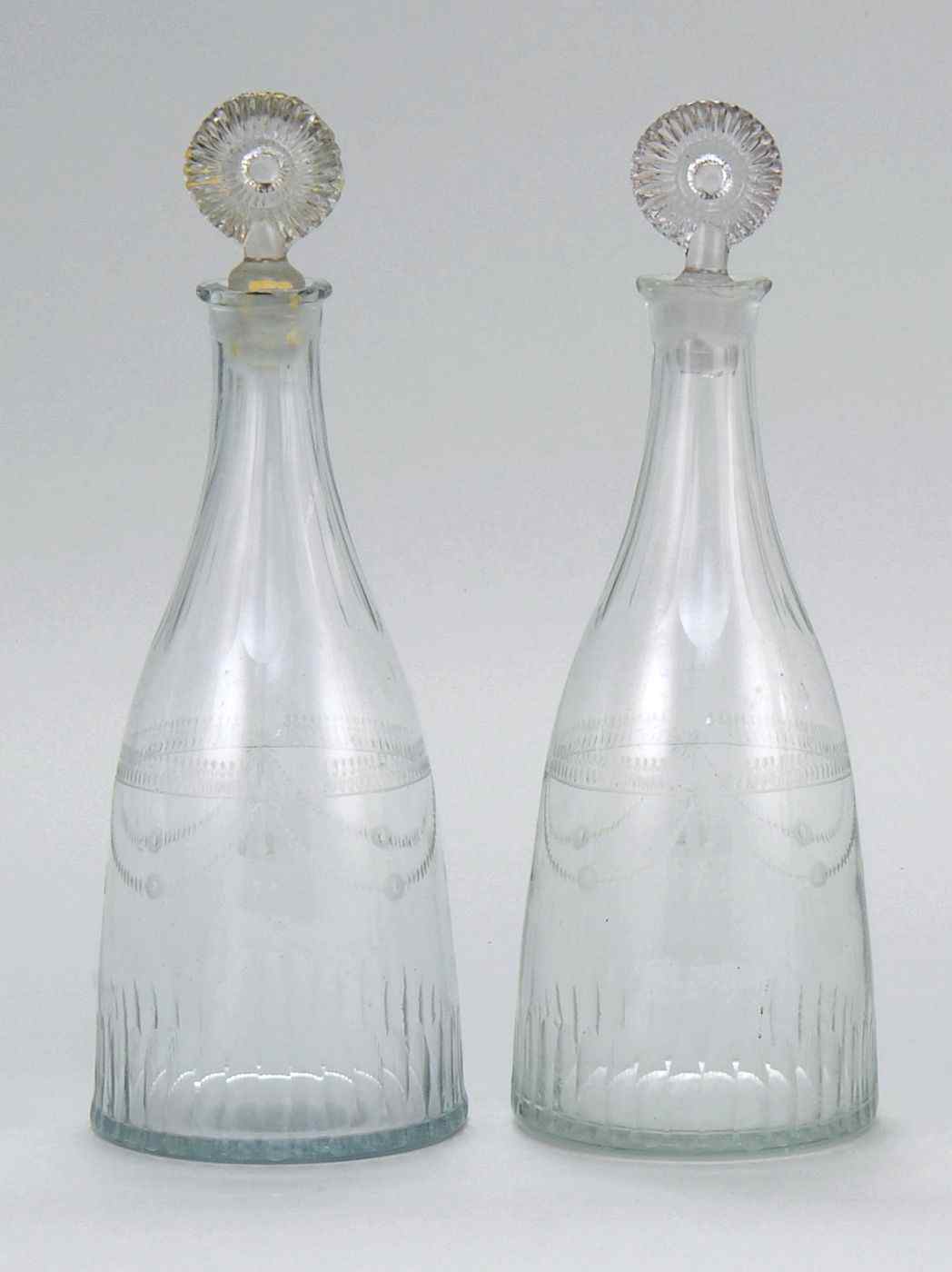 Appraisal: PAIR OF CLEAR GLASS DECANTERSLate th Early th CenturyBodies with