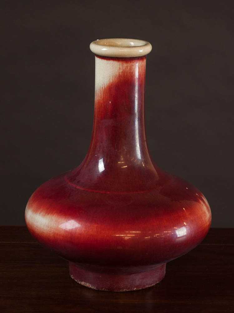 Appraisal: CHINESE QING FLAMBE GLAZED PORCELAIN VASE of compressed bottle form