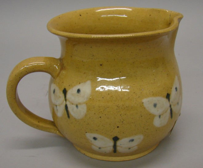 Appraisal: Creamer - Hay Creek Slipware light tan with butterflies applied