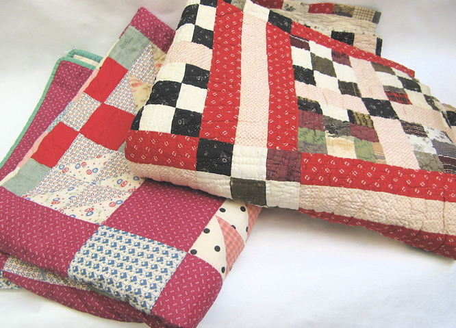 Appraisal: TWO AMERICAN HAND STITCHED PATCHWORK QUILTS one in a flying