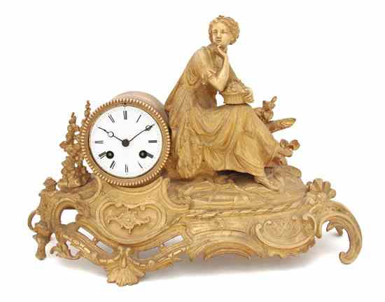 Appraisal: A French Gilt Bronze Figural Mantel Clock cast as a