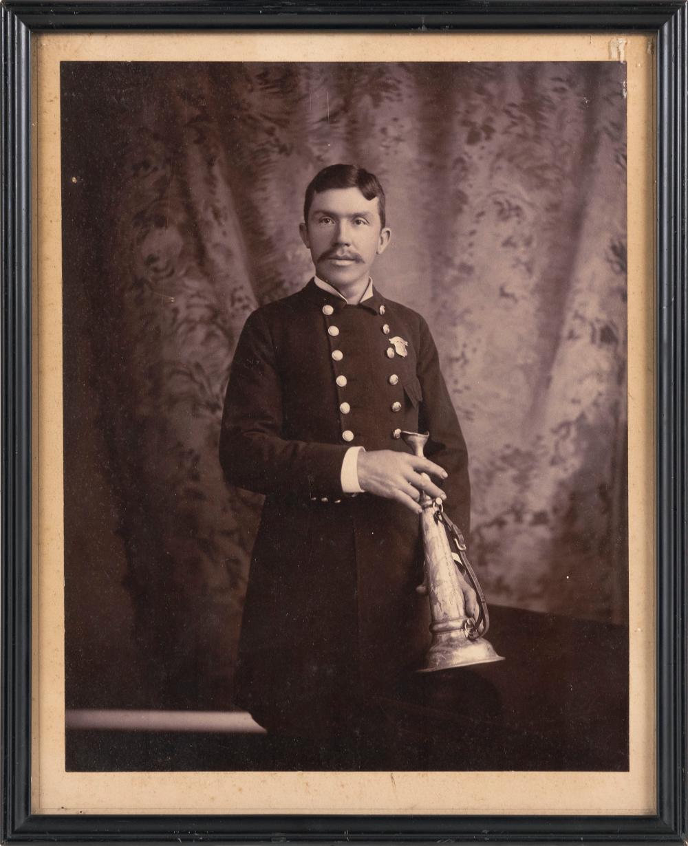 Appraisal: PHOTOGRAPH OF A FIREMAN HOLDING A FIRE TRUMPET TH CENTURY