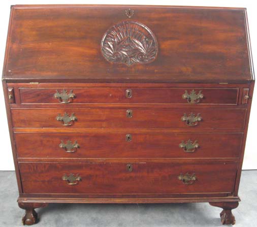 Appraisal: A Mahogany Slant-front Desk with an intaglio carved fan to