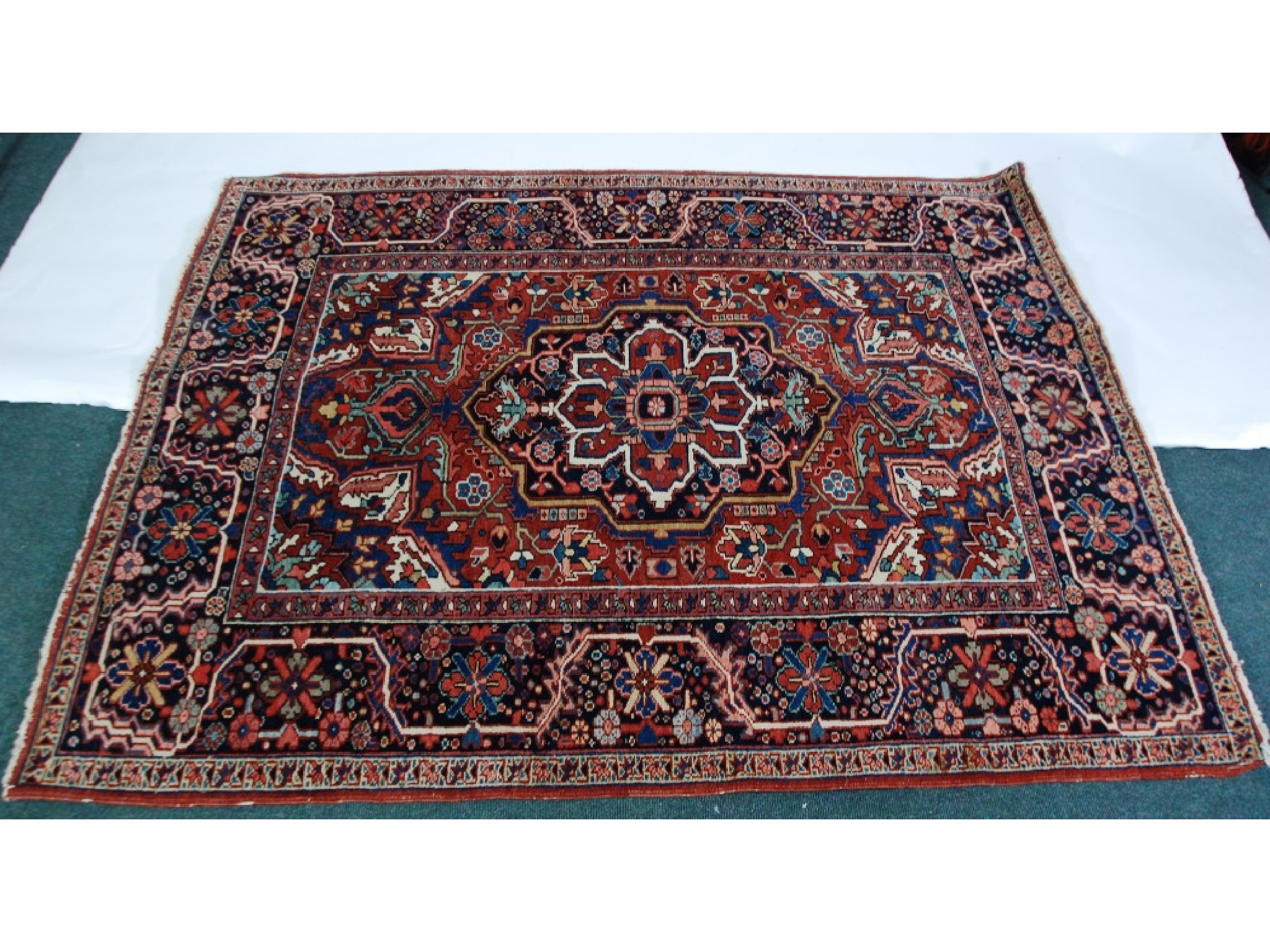 Appraisal: SEMI ANTIQUE PERSIAN WOOL PILE RUG the central medallion field