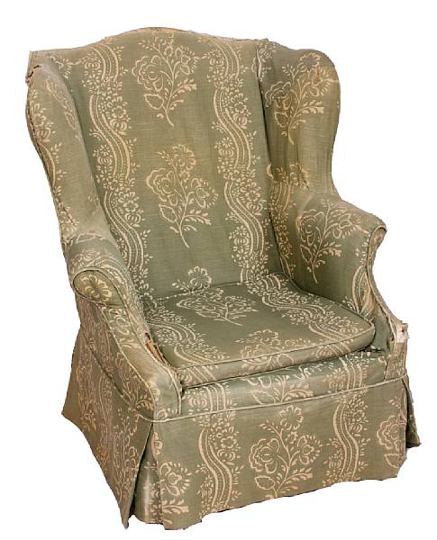 Appraisal: An American upholstered wing back chair with original pewter chamber