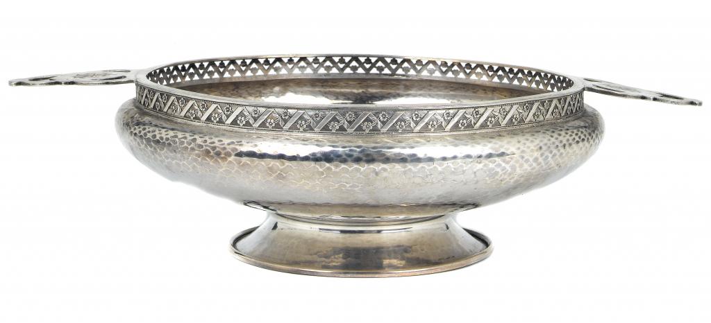 Appraisal: AN A EDWARD JONES SILVER TWO HANDLED BOWL of hammer