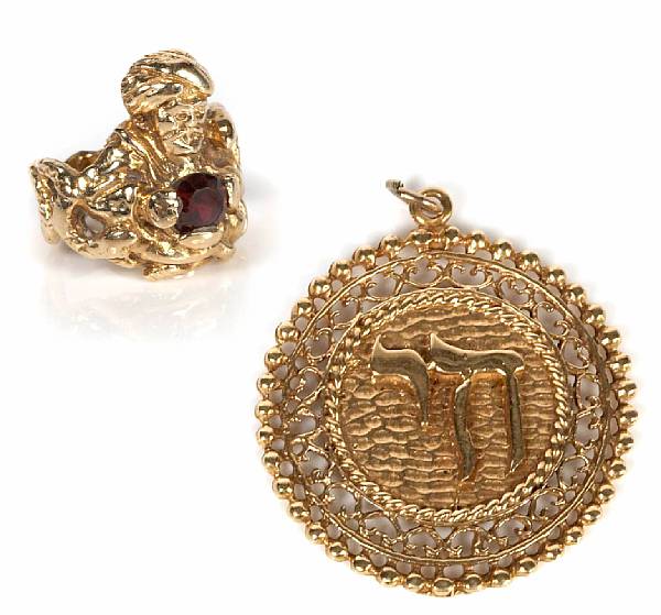 Appraisal: A red stone and gold ring together with a k