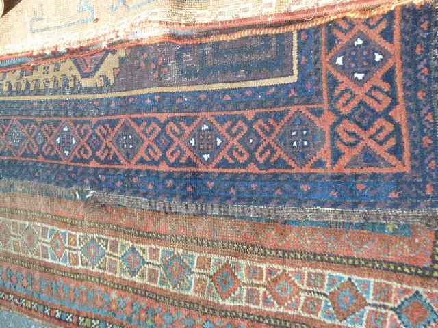 Appraisal: FOUR OLD EASTERN RUGS all worn the largest x