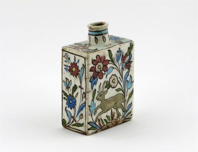 Appraisal: A Middle Eastern pottery square-section flask decorated with running hares