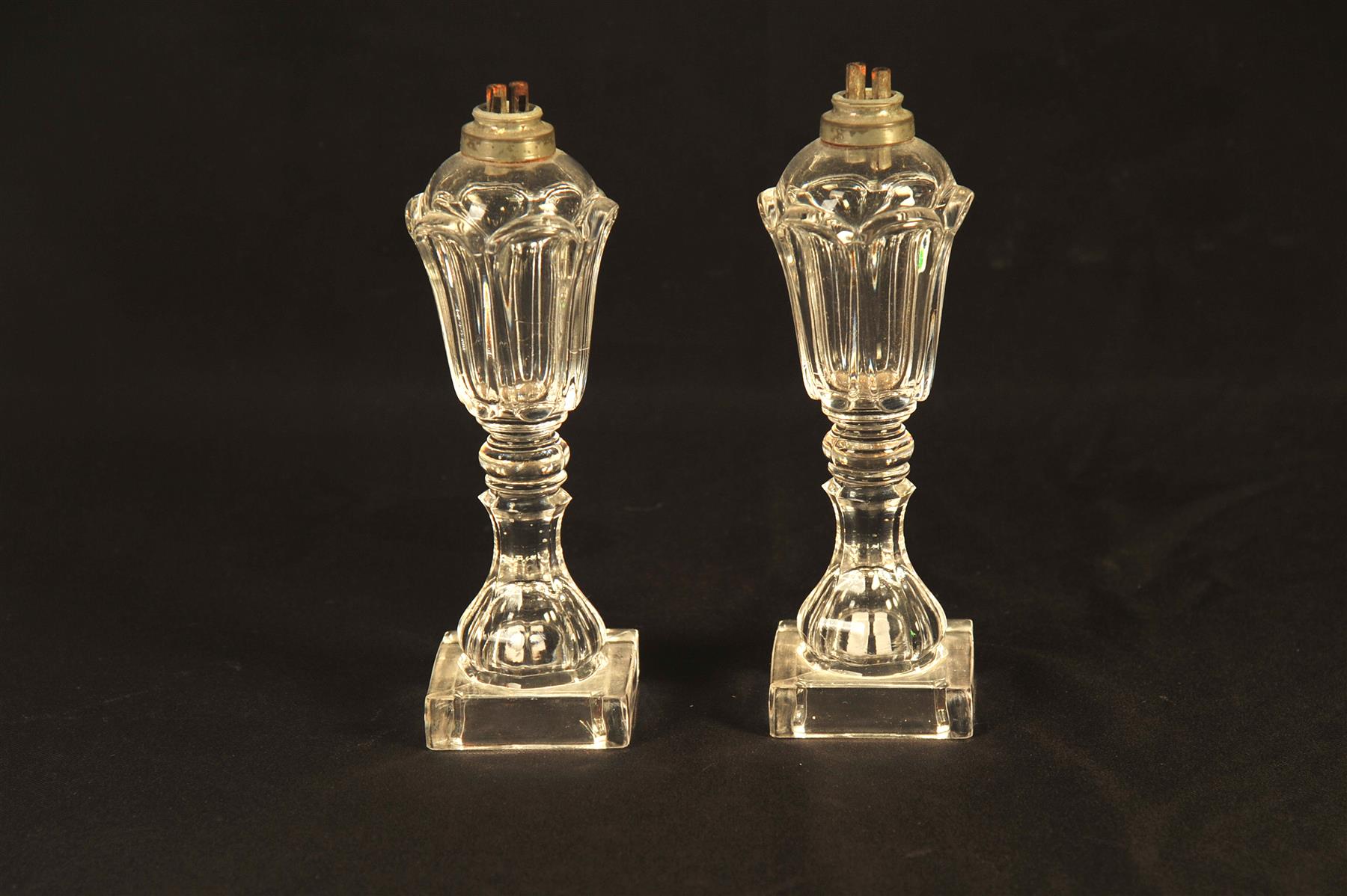 Appraisal: PAIR OF SANDWICH PETAL PATTERN FLINT GLASS WHALE OIL LAMPS