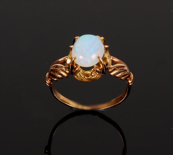 Appraisal: An opal single stone ring the large cabochon opal claw