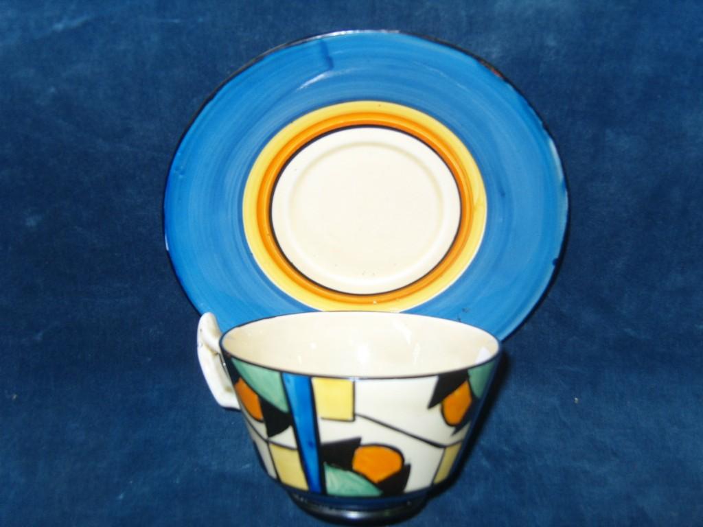 Appraisal: A Clarice Cliff Bizarre cup and saucer with geometric decoration