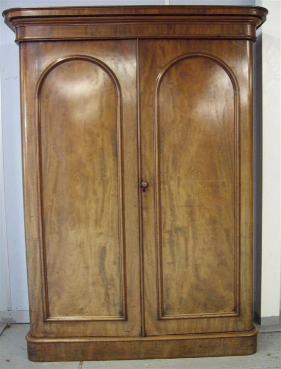 Appraisal: Victorian mahogany double wardrobe with two panelled doors enclosing fitted