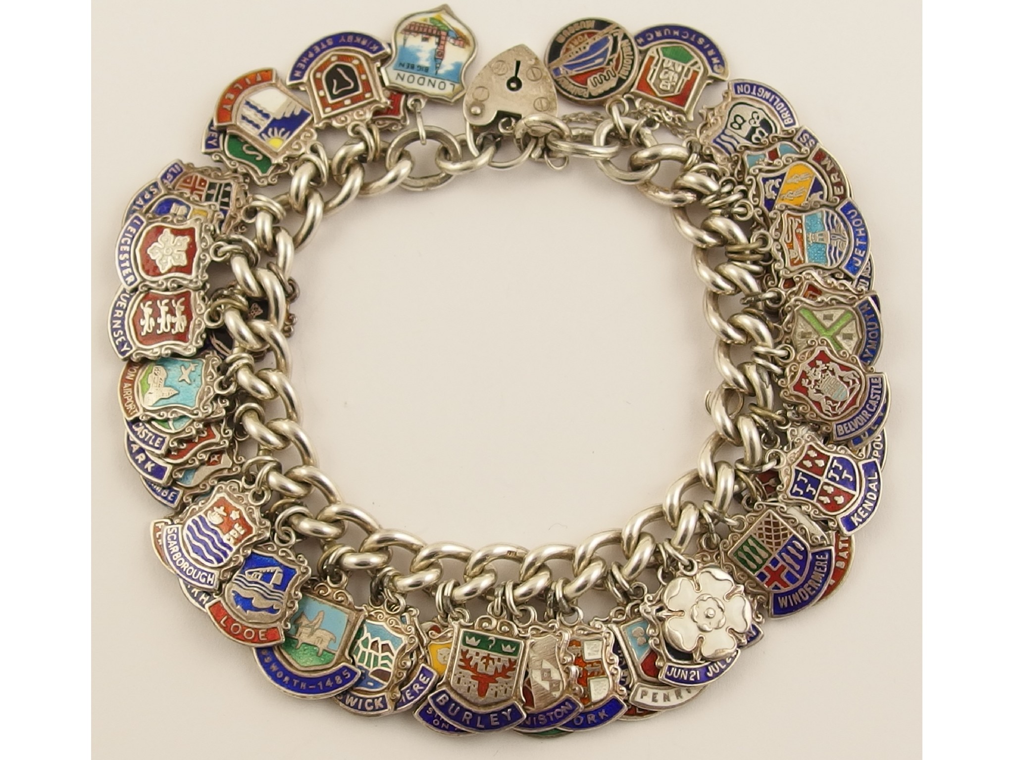 Appraisal: A silver place name enamelled charm bracelet with fifty five