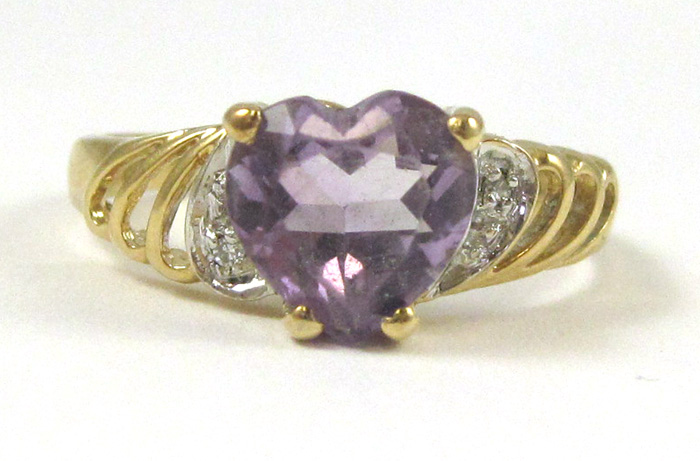 Appraisal: AMETHYST DIAMOND AND FOURTEEN KARAT GOLD RING set with two