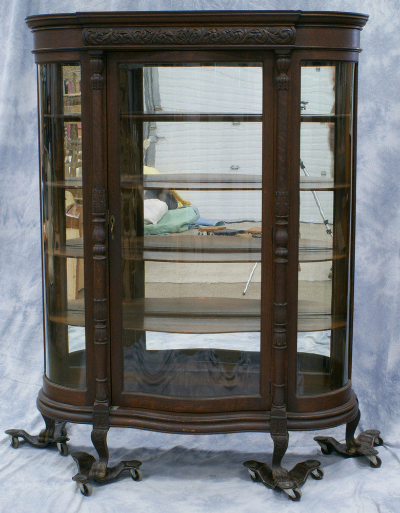 Appraisal: Oak Victorian serpentine front china cabinet with mirrored back wood