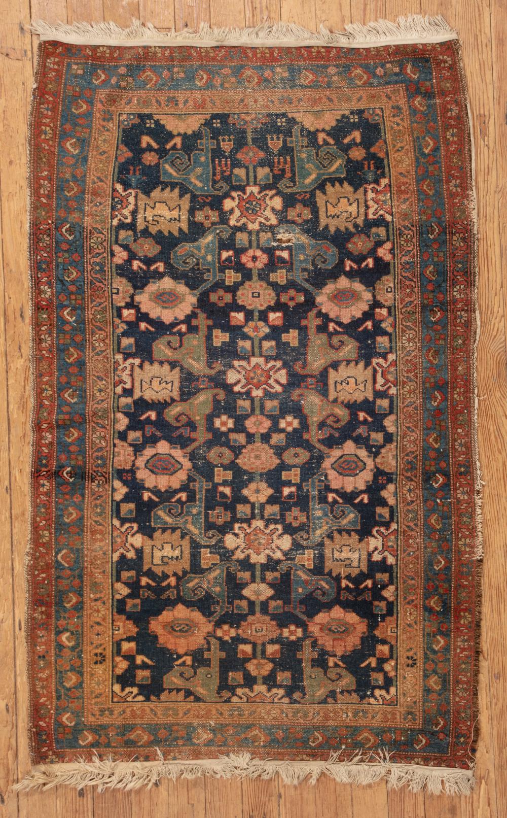 Appraisal: Antique Persian Rug dark blue ground floral design ft in