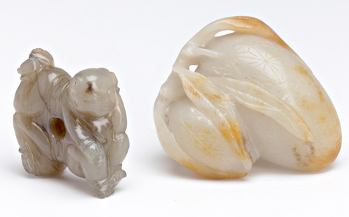 Appraisal: CHINESE JADE Two carved pendants th C one of fruit