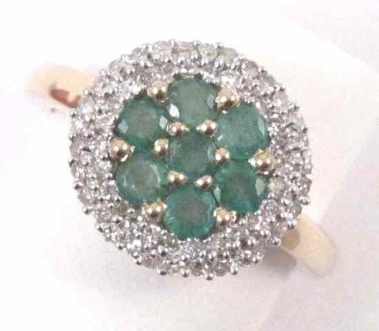 Appraisal: EMERALD DIAMOND AND FOURTEEN KARAT GOLD RING set with seven