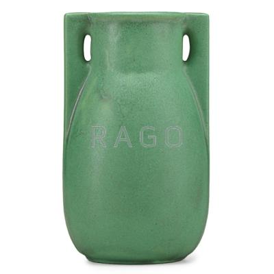 Appraisal: TECO Buttressed vase matte green glaze with charcoaling Terra Cotta