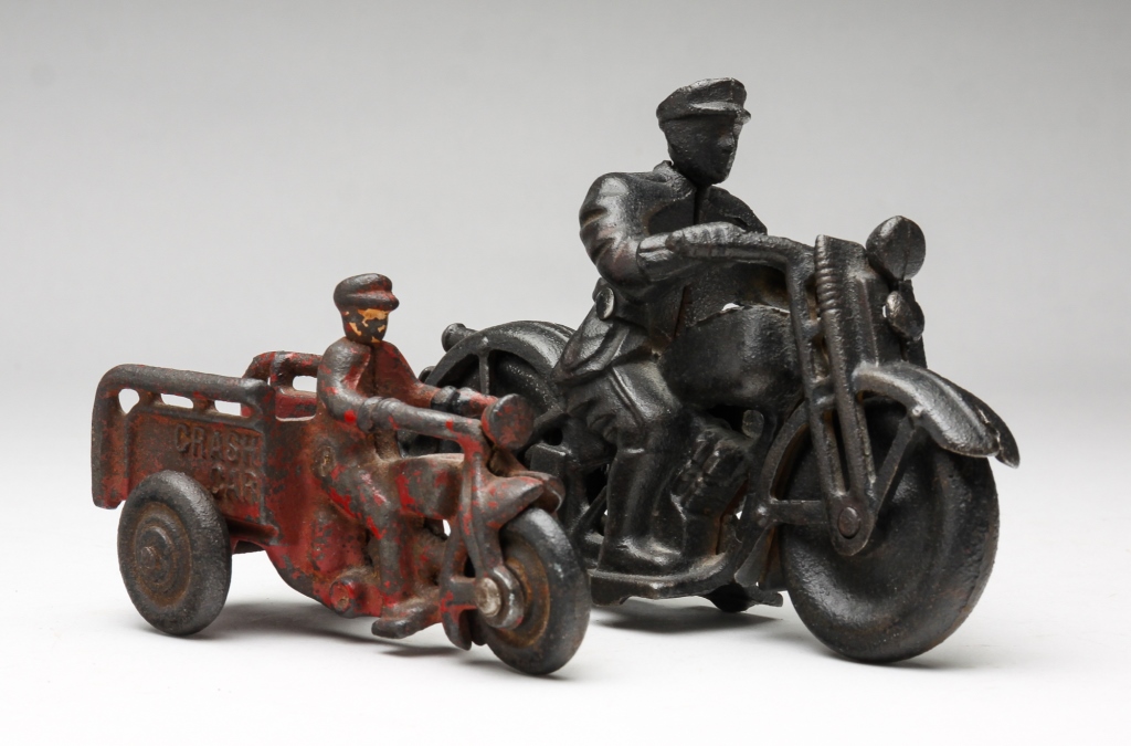 Appraisal: TWO HUBLEY CAST IRON TOYS American twentieth century Patrol motorcycle