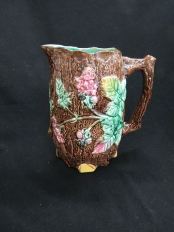 Appraisal: Majolica Pottery Pitcher with Berry floral on bark design excellent