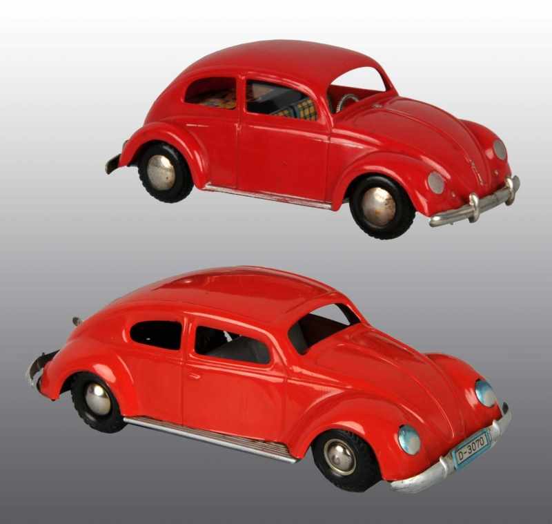 Appraisal: Lot of Tin Plastic Volkswagen Beetle Toys Description German Working