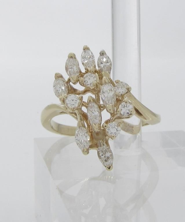 Appraisal: A K yellow gold cluster ring with marquis and round