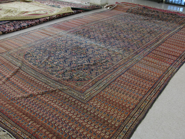 Appraisal: SEMI-ANTIQUE PERSIAN FERAHAN PALACE CARPET having a floral decorated blue