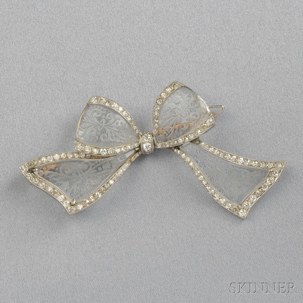 Appraisal: Art Deco Platinum and Rock Crystal Bow Brooch the carved