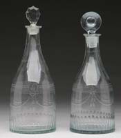 Appraisal: TWO EARLY BLOWN CLEAR GLASS DECANTERS Similar designs of cut