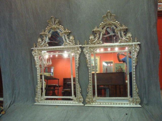 Appraisal: Pair of Elaborately Carved Antique Silver Gilt Mirrors from the