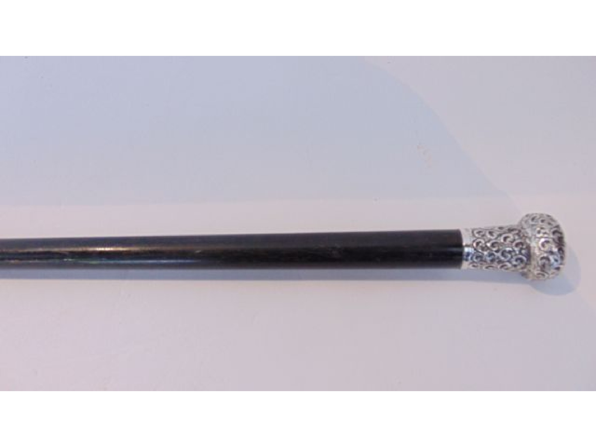 Appraisal: A Victorian ebonised cane with applied silver knop handle with