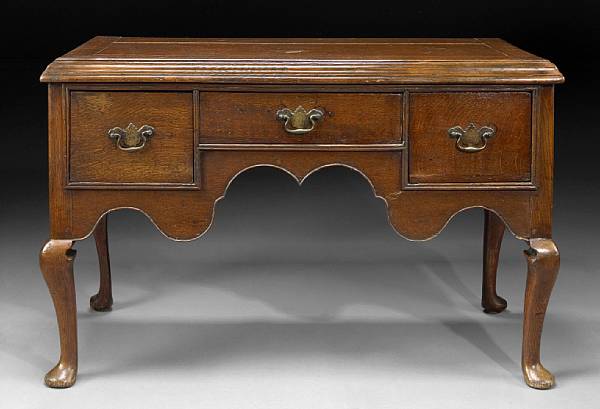 Appraisal: A George II oak lowboy mid th century formerly a