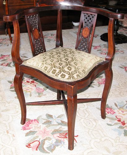 Appraisal: Artist Title Mahogany corner chair rolled inlaid back horse shoe