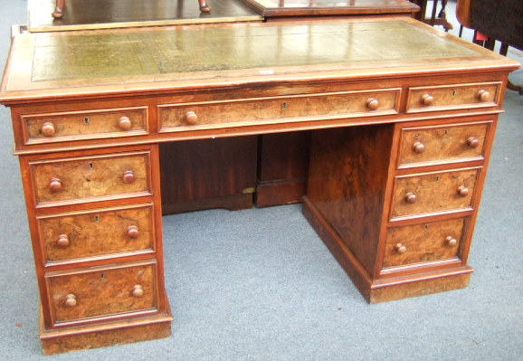 Appraisal: A Victorian figured walnut pedestal desk the gilt tooled green