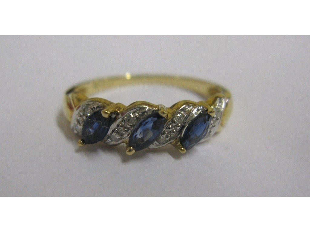 Appraisal: Nine carat gold marquise sapphire and diamond half hoop ring