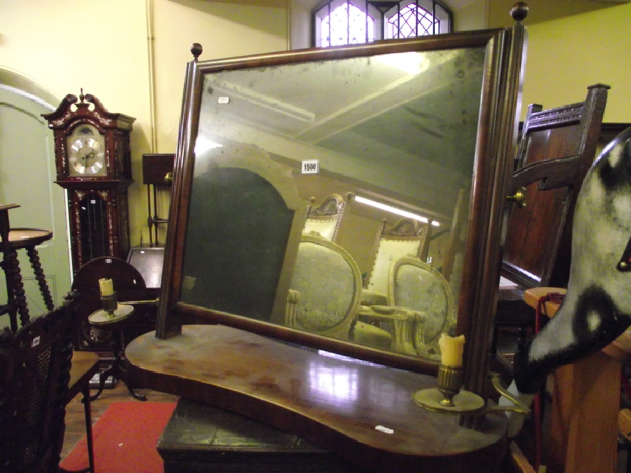 Appraisal: An early Victorian mahogany toilet mirror the platform base incorporating