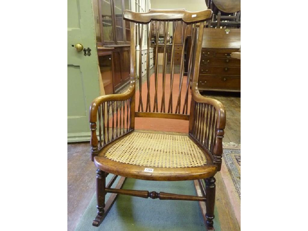 Appraisal: A Victorian rocking chair with entwined stick panels surrounding a