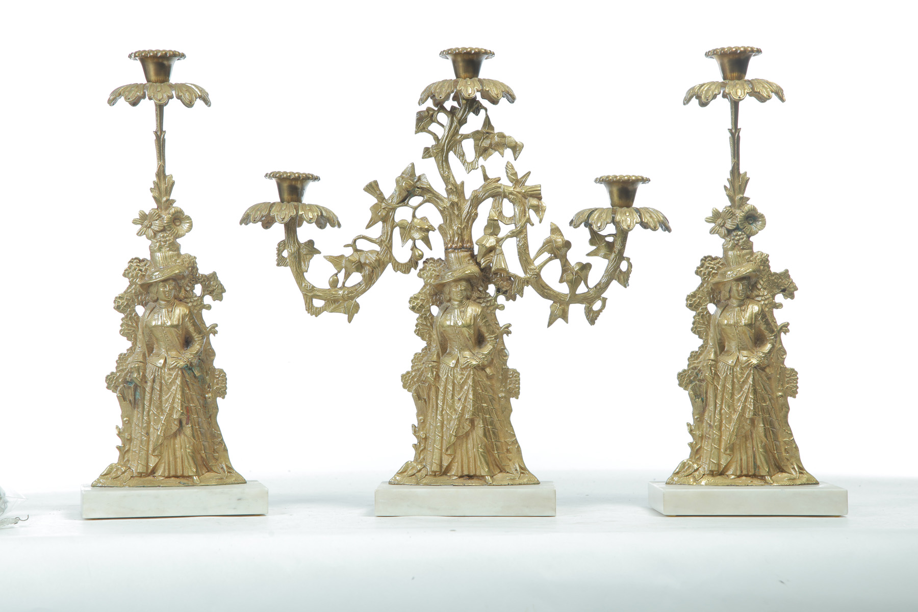 Appraisal: THREE-PIECE BRASS GIRANDOLE SET WITH FIGURAL STEMS American mid- th