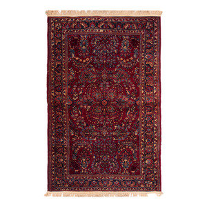 Appraisal: A Sarouk Rug th Century feet inches x feet inches